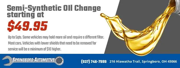 Advertisement for semi-synthetic oil change starting at $49.95. Background shows pouring golden oil. Offer details included. Business details: Springboro Automotive, phone number, and address in Springboro, OH.