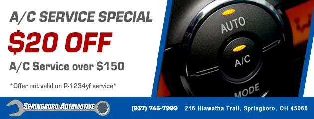 Advertisement for A/C Service Special offering $20 off A/C service over $150, excluding R-1234yf service. Features an image of a cars A/C control dial. Includes contact info for Springboro Automotive in Springboro, OH.