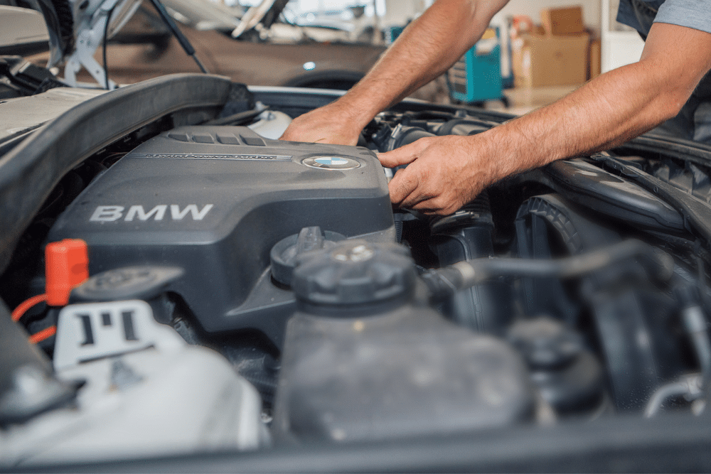 European Auto repair in Springboro, OH. Springboro Automotive. A technician working on a BMW engine, providing expert repair services for European vehicles in Springboro, OH.