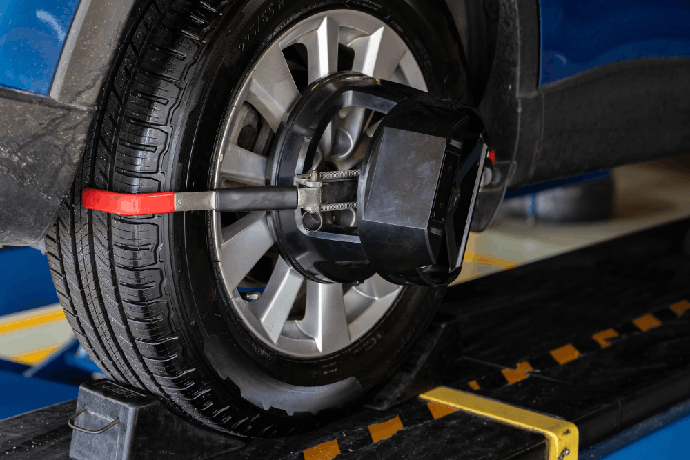 Wheel alignment, auto repair in Springboro, OH by Springboro Automotive. Image of a vehicle wheel mounted with a digital alignment sensor on an alignment rack. Highlighting precise steering control, even tire wear, and safe, stable driving performance.