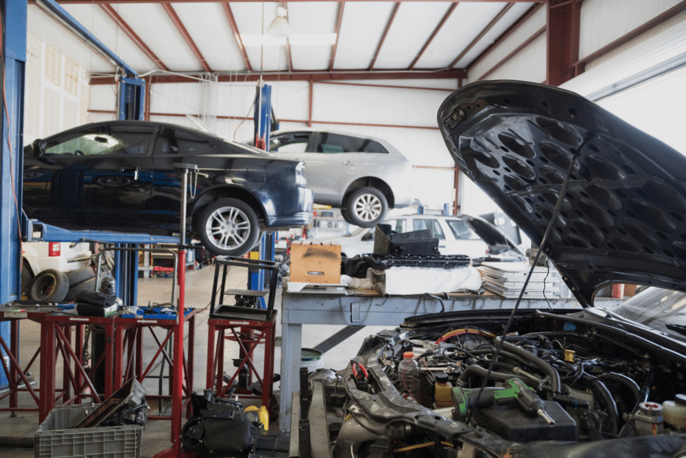 Vehicle Inspection in Springboro, OH At Springboro Automotive. Multiple cars raised on hydraulic lifts inside an active auto repair shop